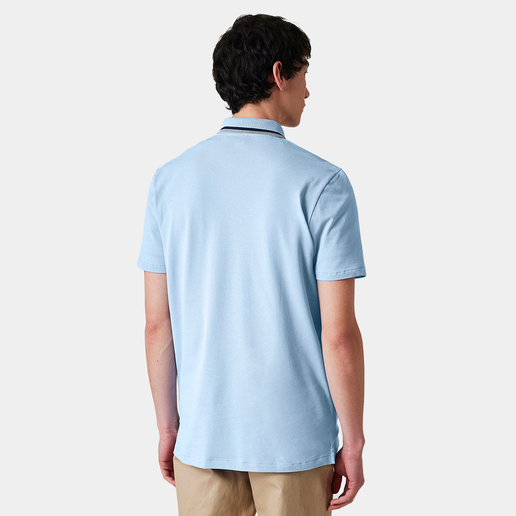Polo azul claro de algodón orgánico con cuello con cremallera