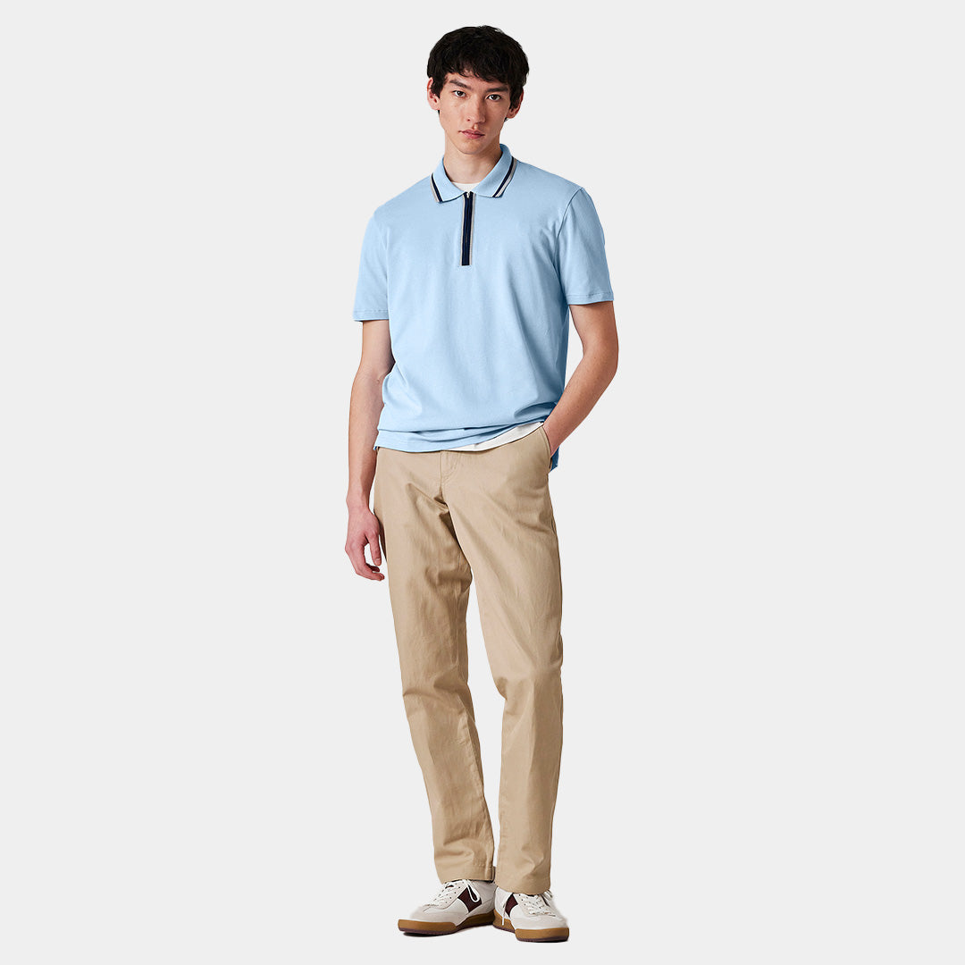 Polo azul claro de algodón orgánico con cuello con cremallera
